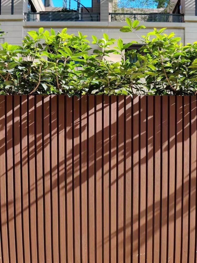 Close-up of Brown Wood Grain Outdoor WPC Slat Fence Wall for Courtyard