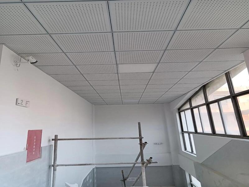 Completed Corridor Ceiling with Perforated Metal Tiles & Painted Steel T-Grid System